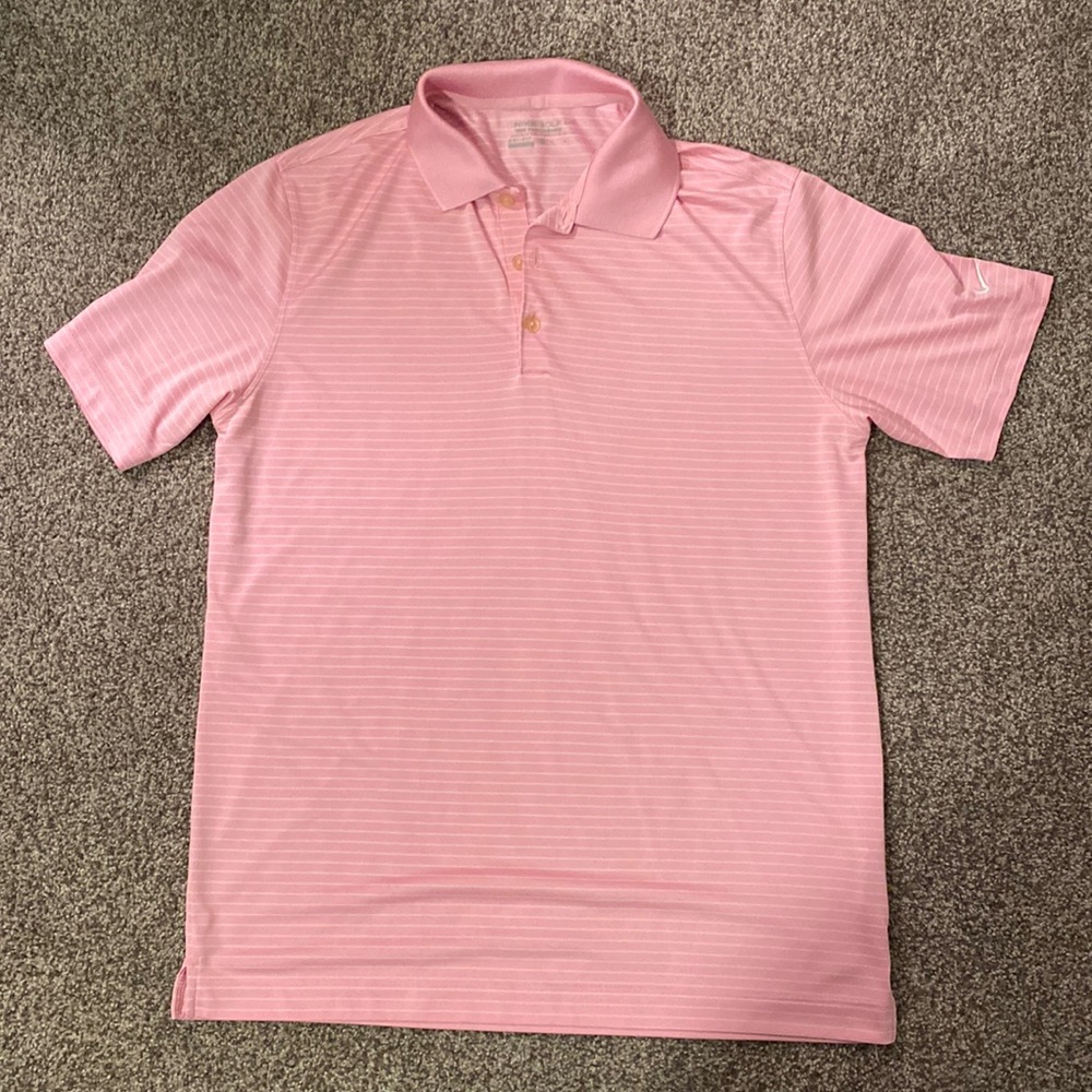 Medium pink and white striped white Nike golf shirt.